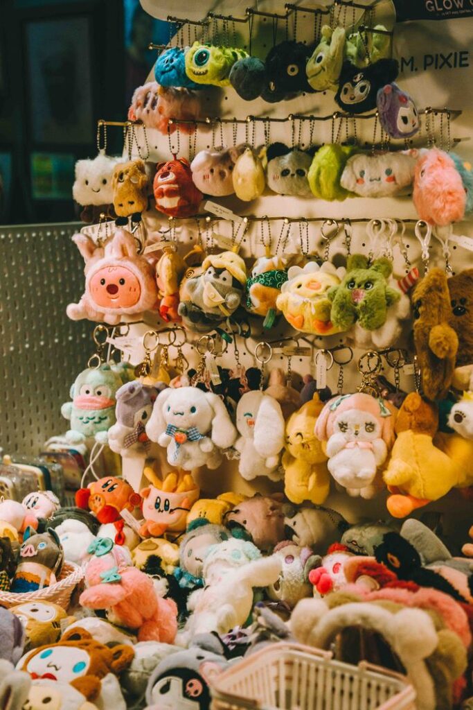 Vibrant array of plush toys and keychains on display in a Kuala Lumpur store.